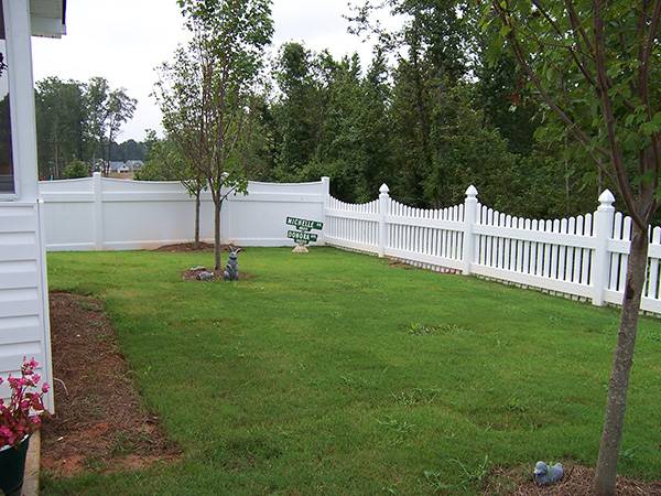 Fence types. White picket fence backyard