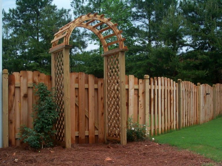 wood fencing. Scalloped Shadowbox fence with Trellis