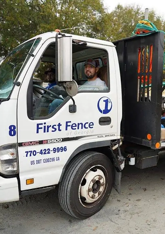 Atlanta fence company worker in a truck