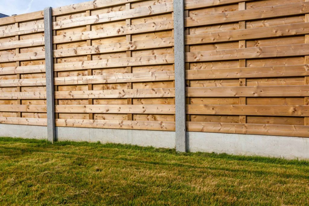 wooden fence with metal posts