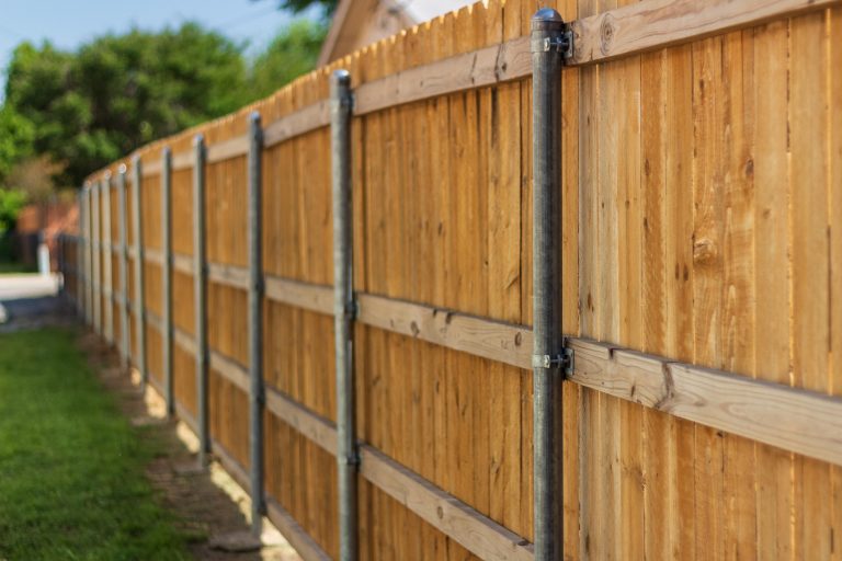 wooden fence with metal posts