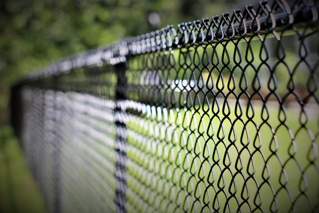 Close-up of a black chain-link fence